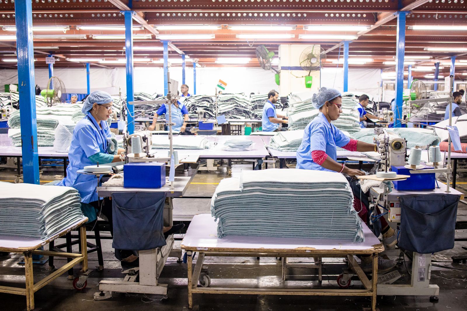 A factory floor with workers at their stations